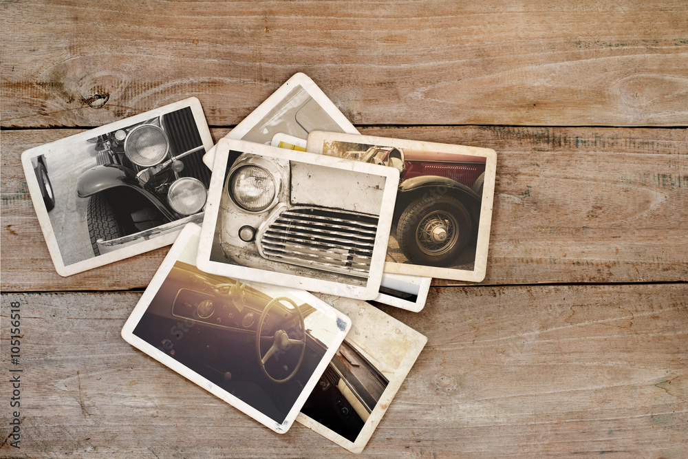 Naklejka premium Classic car photo album on wood table. instant photo of polaroid camera - vintage and retro style