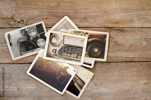 Classic car photo album on wood table. instant photo of polaroid camera - vintage and retro style