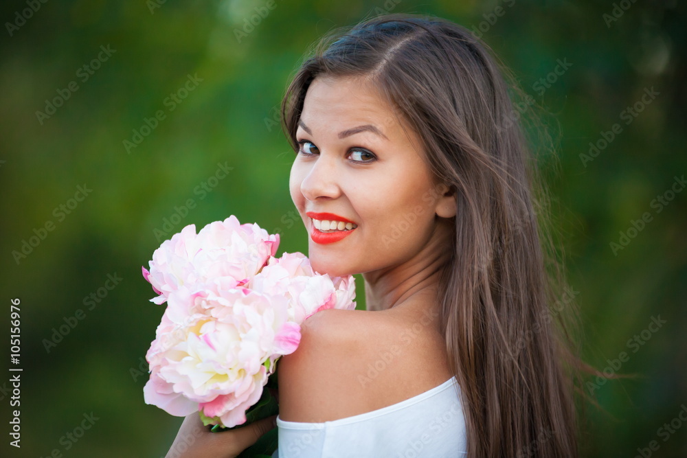 brunette woman with white peonies