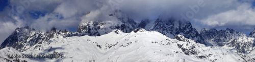 Panoramic view on Mounts Ushba and Chatyn in haze at sunny day