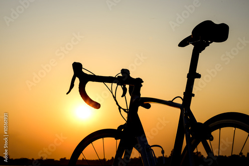 silhouette bicycle on a sunset background