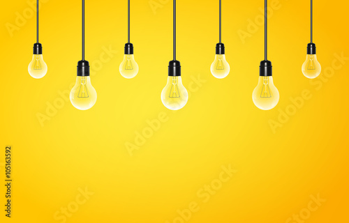 Hanging light bulbs on a yellow background with copy space. Vector illustration for your design.