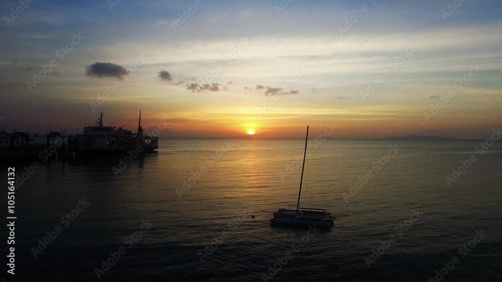 Samui ferry boats on the sunset on island in Thailand Samui ferry boats on the sunset on island in Thailand