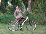 Pin-up girl poising on a bike
