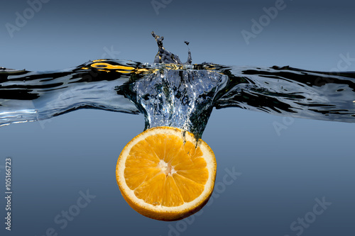 Fototapeta Naklejka Na Ścianę i Meble -  tropical fruit orange in water