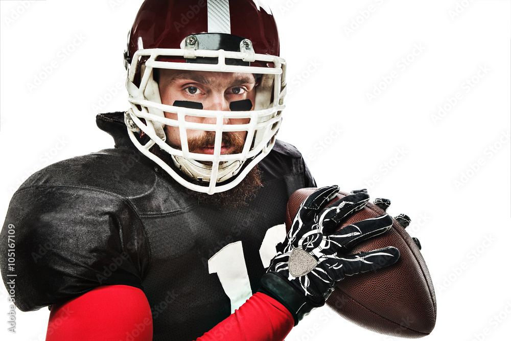 American football player posing with ball on white background