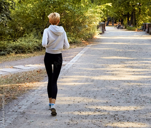 Anorexic woman running in park