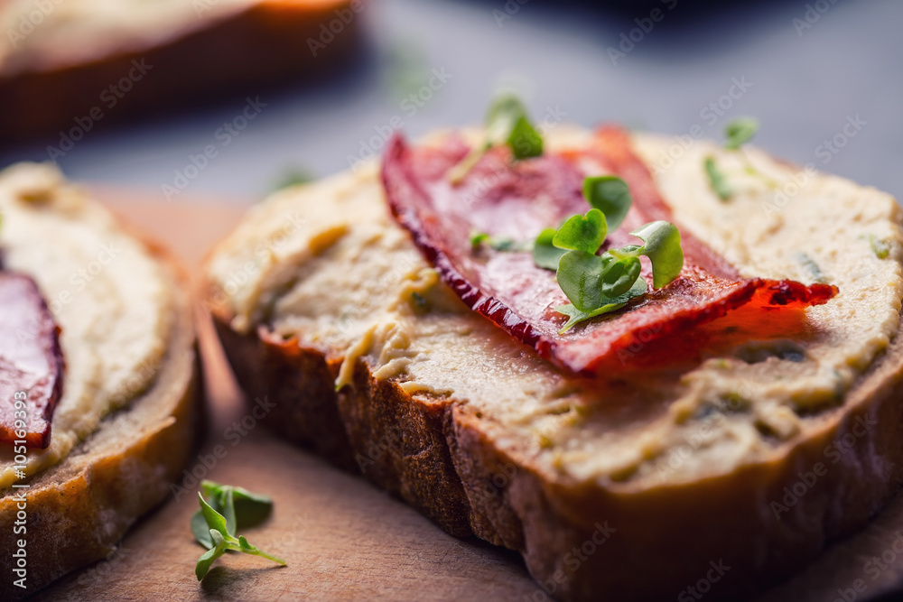 Spreads. Egg spread, grilled bacon, bread young basil leaves, Herb decoration. Ingredients: six eggs, spring onion, yeast, processed cheese, bacon, salt, pepper, various herbs decorations.