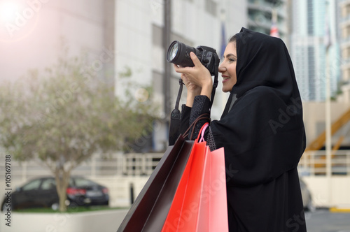 Emarati Arab woman coming out of shopping