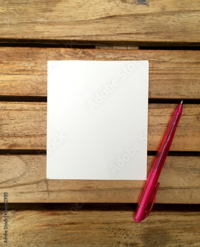 note paper in a wood background