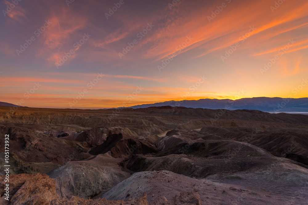Orange sky over the dry hills. Sanset at Artist's Drive, Death Valley National Park