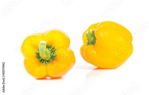 Yellow bell peppers cut pieces on white background. © sarawutnirothon