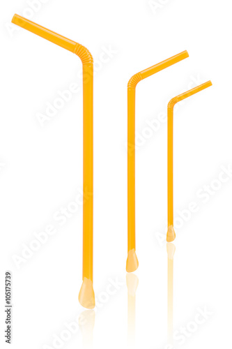 Three yellow straws with spoon isolated on white