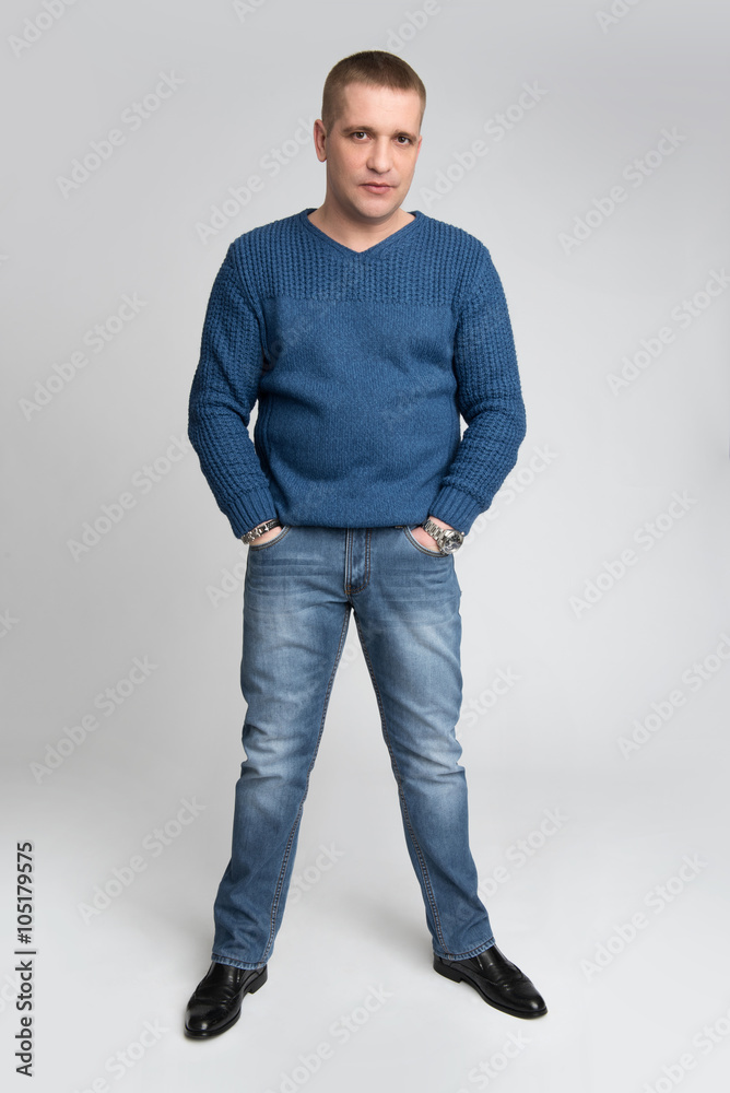 man holding his hands in pocket man holding his hands in pocket