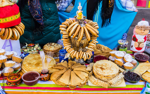 Shrovetide at Russia. Maslenitsa, meal,pancakes, bagels, samovar photo