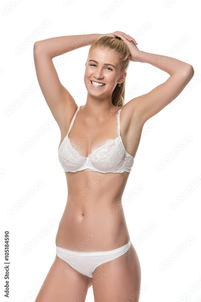 Young blonde woman in white underwear, studio Young blonde woman in white underwear, studio