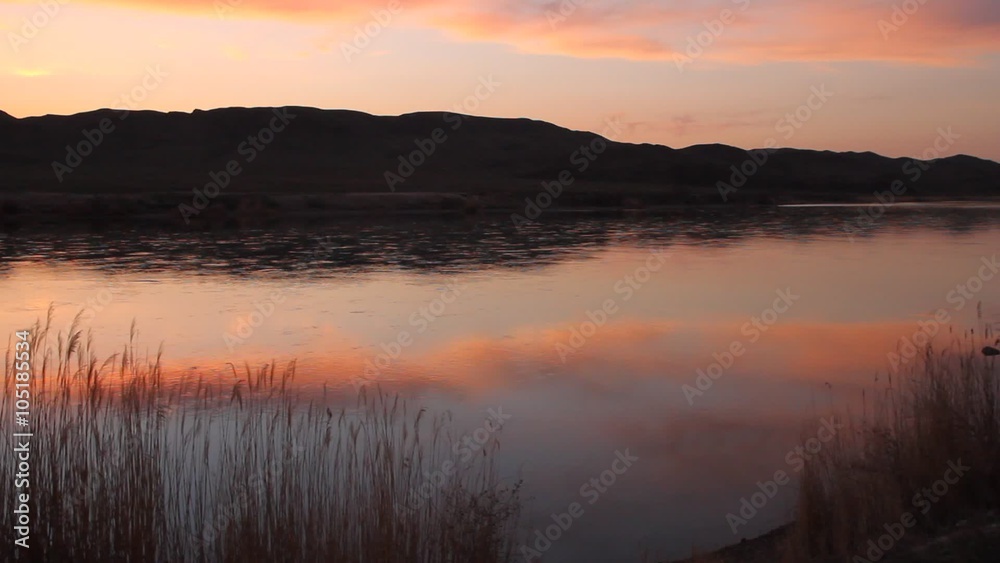 Beautiful sunset reflected in the surface of the river Beautiful sunset reflected in the surface of the river