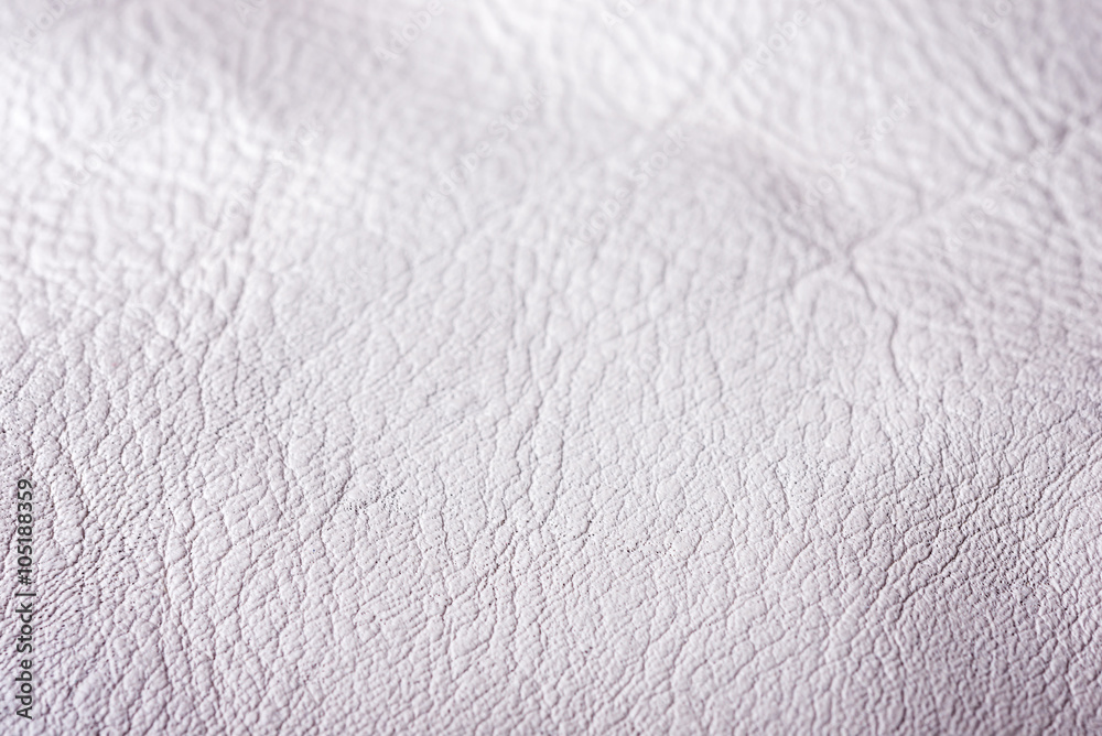 Natural white leather background closeup. Selective focus. Natural white leather background closeup. Selective focus.
