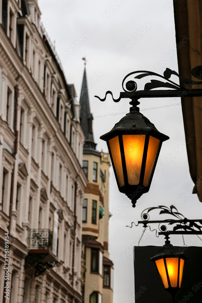 Beautiful street lanterns illuminated at evening. Riga. Latvia.