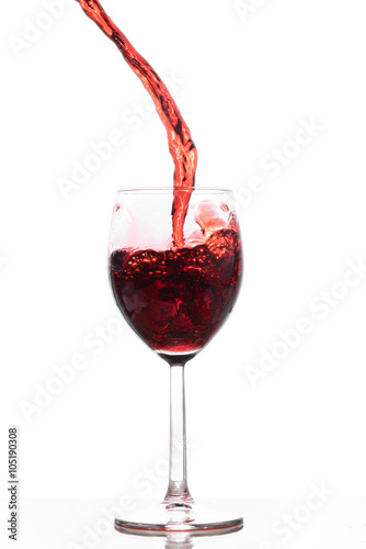 Red wive pointing into a glass