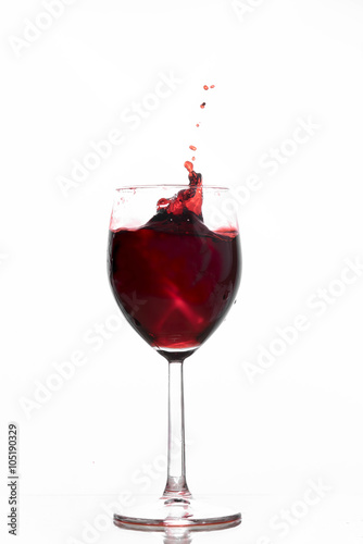 Red wine waving into a glass