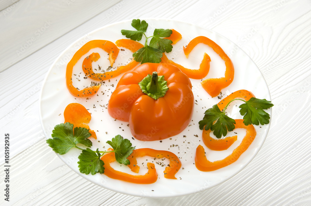 chopped orange pepper on  round white plate