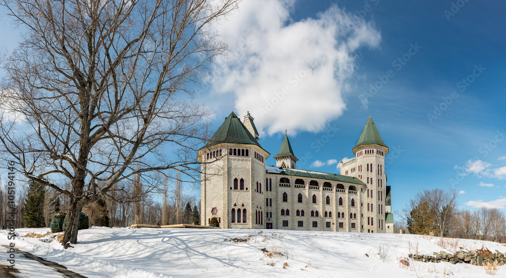 Gorgeous Saint Benois Monastery for men (Quebec, Canada) in bright winter day.