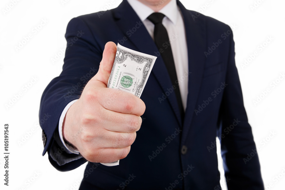 Businessman holding a bundle of dollars in hand Businessman holding a bundle of dollars in hand
