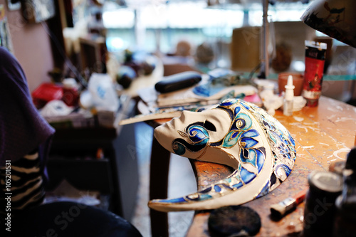 Beautiful Venetian mask, white and blue colors on the shop table