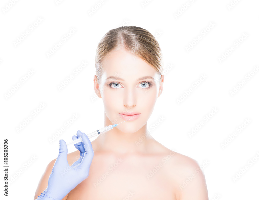 Doctor injecting botox into a woman's face Doctor injecting botox into a woman's face