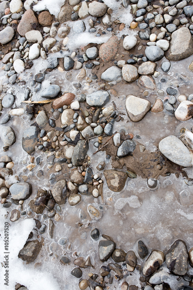 Stones in the ice on the nature Stones in the ice on the nature