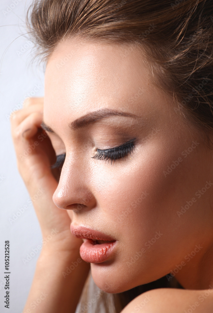 Close up portrait of beautiful young woman face. 
