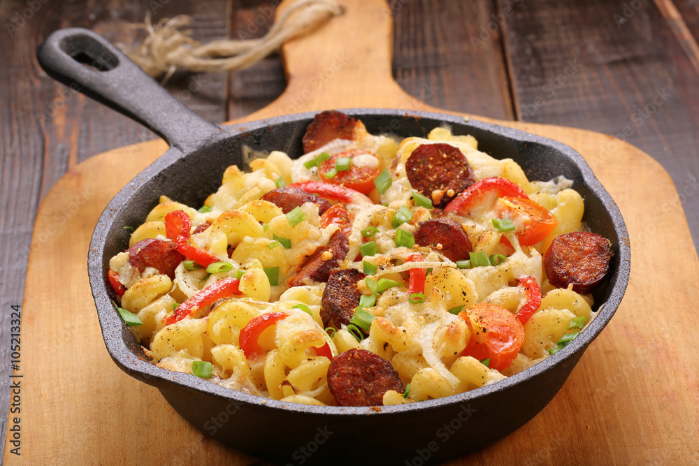 Casserole with chorizo sausage in a frying pan Casserole with chorizo sausage in a frying pan