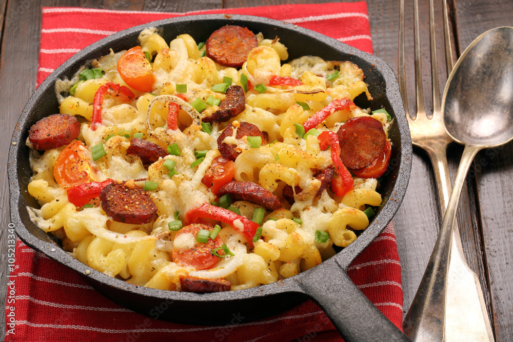 Casserole with chorizo sausage in a frying pan