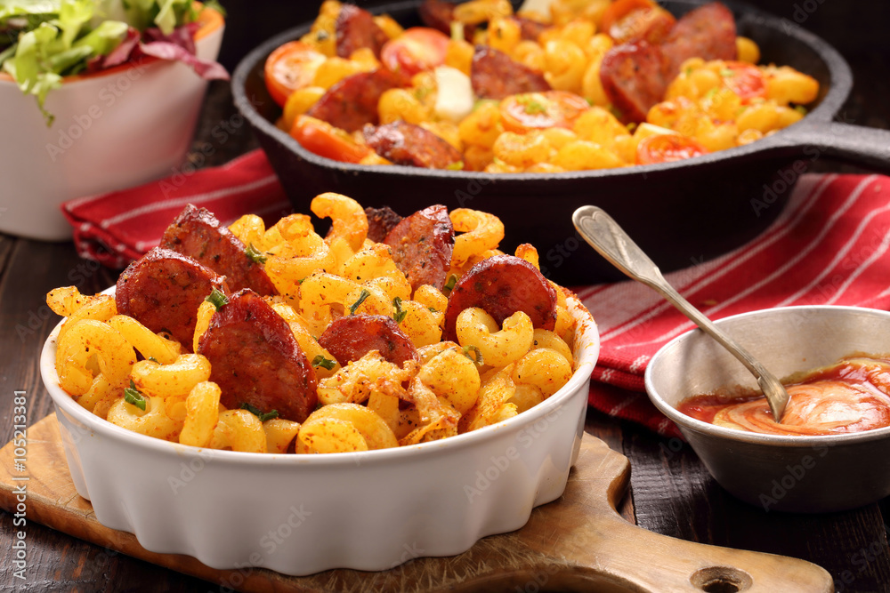 Casserole with chorizo sausage on wooden background Casserole with chorizo sausage on wooden background