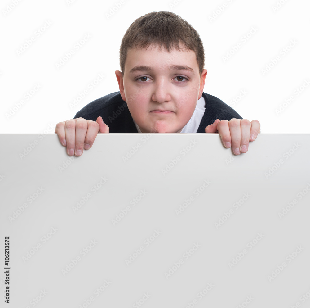 boy looking out of a blank whiteboard smiling boy looking out of a blank whiteboard smiling