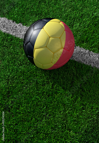 Soccer ball and national flag of Belgium   green grass
