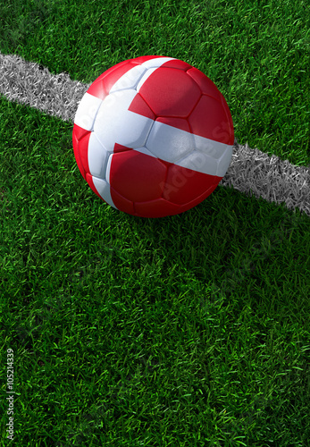 Soccer ball and national flag of Denmark   green grass