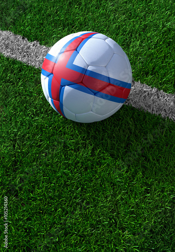 Soccer ball and national flag of Faroe Islands   green grass