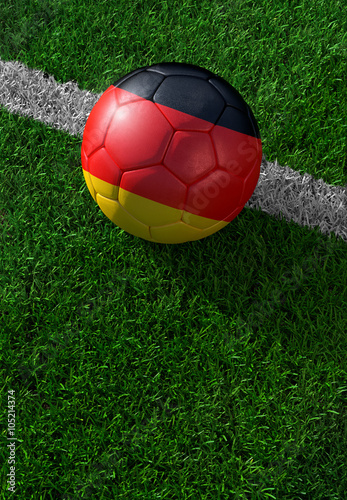 Soccer ball and national flag of Germany   green grass