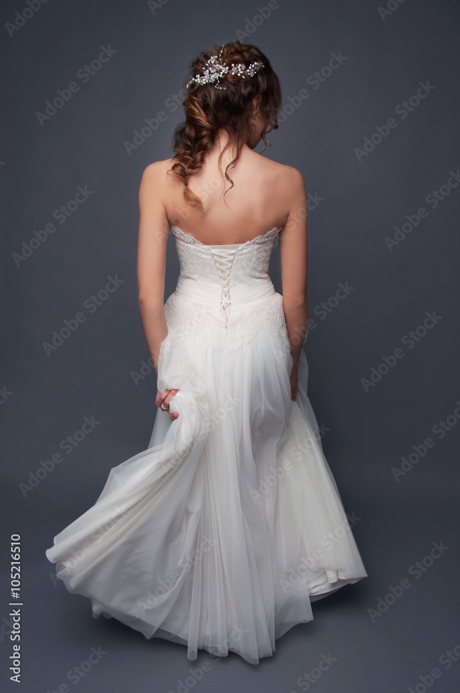 Bridal fashion. Brunette bride view from the back. Bridal fashion. Brunette bride view from the back.
