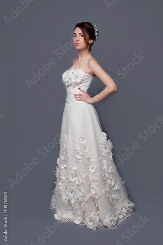 Elegant bride with short hair updo and bare shoulders dress