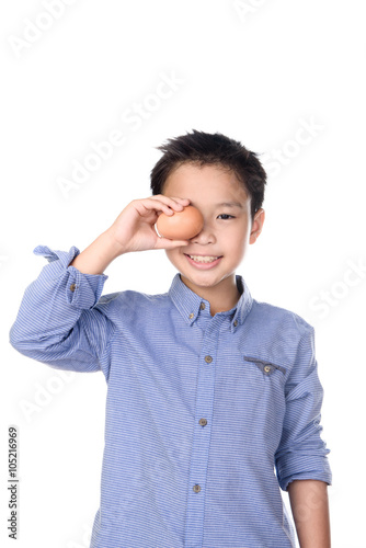 Kid hand and egg