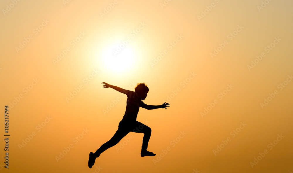 silhouette of a jumping man against the sunset