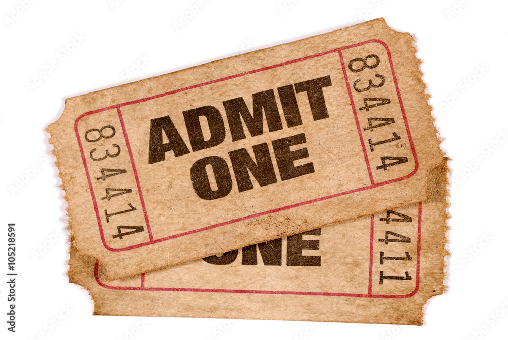 Naklejka premium Two old torn faded and stained admit one movie or theater cinema ticket stub isolated on white background photo