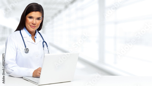 Doctor woman with laptop.