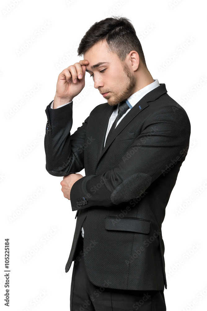 Young man in business suit, thinking about something, isolated on a white background Young man in business suit, thinking about something, isolated on a white background