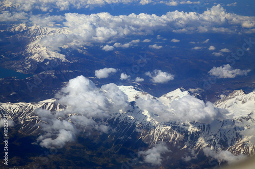 Aerial view snow mountain from window of airplane