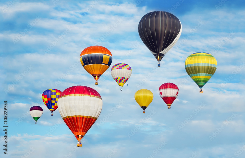 Naklejka premium Hot Air Balloons In Cloudy Blue Sky