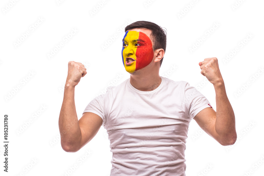 Naklejka premium unexpectedly happy and success emotions of Romanian football fan in game support of Romania national team on white background. European football fans concept.